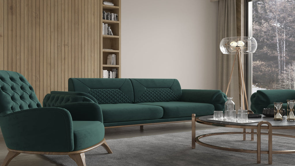 Detailansicht einer grünen Polstergarnitur mit Sofa und Sessel, rundem Couchtisch und moderner Stehleuchte in hellem Wohnzimmer mit Holzwand.
