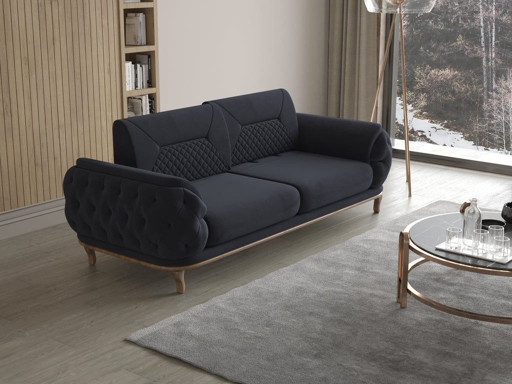 Dunkelblaues 2-Sitzer-Sofa mit gesteppter Rückenlehne und gerundeten Armlehnen in modernem Wohnzimmer mit Holzwand und großer Fensterfront.